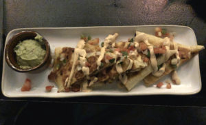 Noche's chicken fajita quesadilla offers a delicious flavor combination.