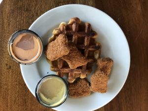 A thick, sugar-coated Liege waffle forms a base for a batch of Nuggs, a new meatless chicken suggest with a crunchy breading and surprisingly persuasive chicken flavor.