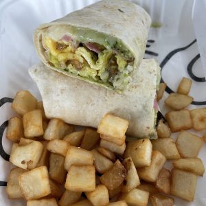 Con Huevos' burrito gordo stuffs a hefty breakfast pf scrambled eggs, potatoes, and more, into a tightly rolled wheat tortilla with perfect home-fry dice on the side.