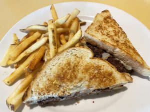 The Wild patty melt is like a burger with a college education, placing a half-pound patty, pepperjack cheese between grilled sourdough slices with bourbon-glazed onions and horseradish aioli.