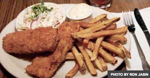 plate of fried fish, fries, slaw