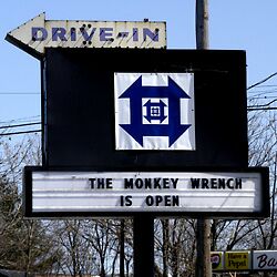 Monkey Wrench sign and logo