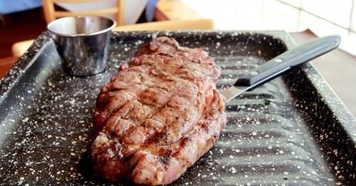 Flank steak on the parrilla at Palermo Viejo. LEO Photo by Ron Jasin.