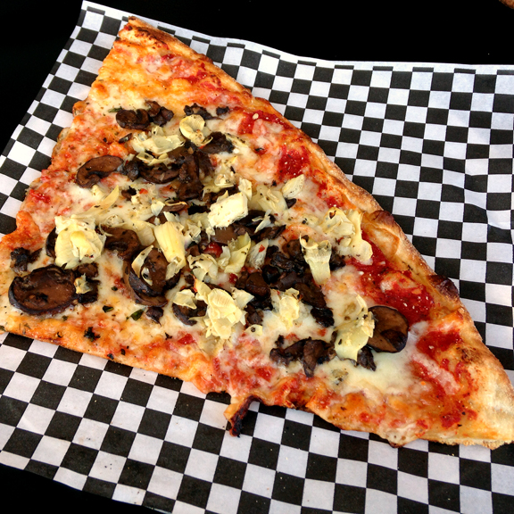 Mushroom and artichoke pizza slice at Papalino's Springhurst.