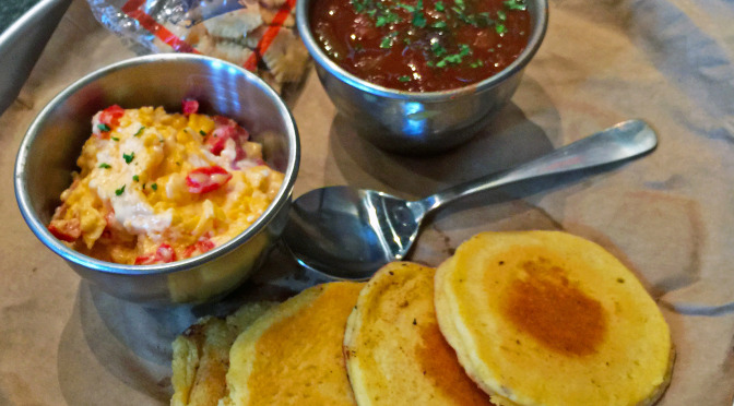 Against the Grain's cornbread hoecakes with homemade pimento cheese, and a cup of black-bean chili