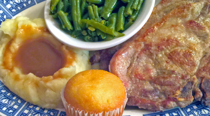 Grilled pork-chop dinner with mashed potatoes and gravy, green beans and muffin at Cottage Inn