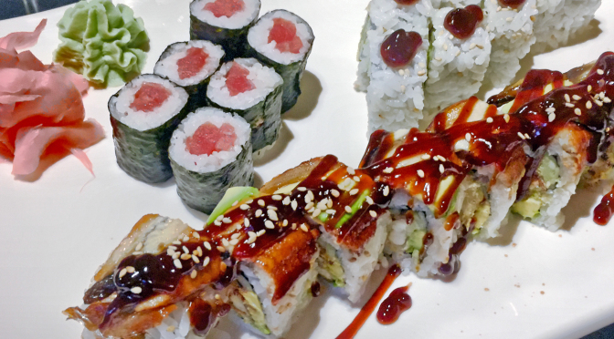 A sushi plate at Asahi: Dragon roll, tuna roll and AAC roll.