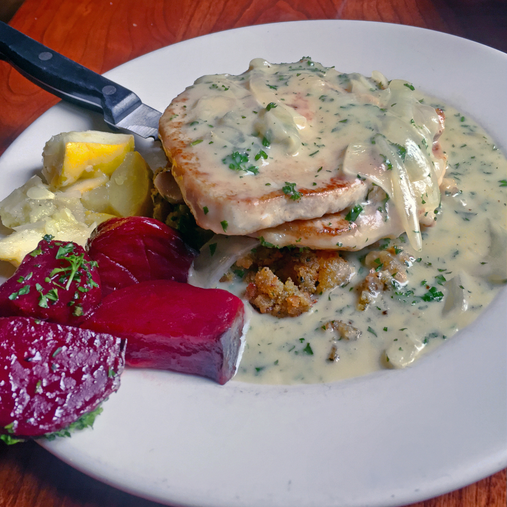 The Trustees’ Table’s smothered pork loin.