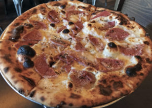 Garage Bar’s new seasonal pizza, Ravanello, topped with radish bagna cauda and fior di latte.