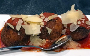 Arancini, prosciutto- and cheese-stuffed rice balls at Loui Loui's.