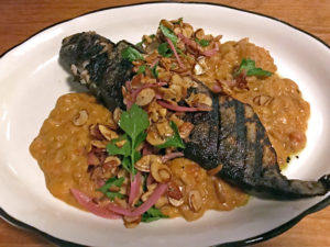 Portage House’s grilled whole trout with stewed lima beans.