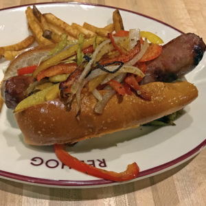 Red Hog’s Jody Maroni’s grilled Italian sausage sandwich with peppers and onions.