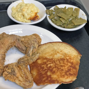 Fried chicken with sides of green beans and macaroni and cheese at Irma Dee’s.