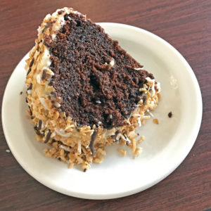 Irma Dee’s homemade chocolate cake with coconut, caramel and chocolate icing.