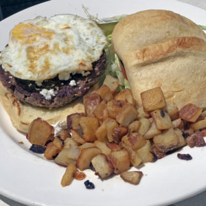 Wild Eggs’ Bowling Alley burger with goat cheese and a fried egg.