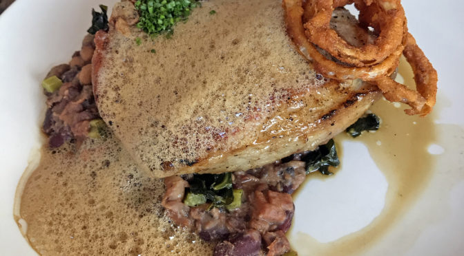 Harvest’s smoked Marksbury Farm pork loin chop with red-eye gravy foam.