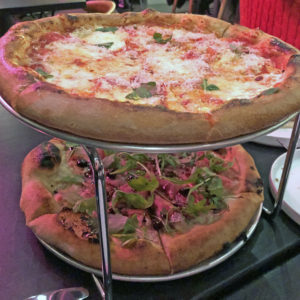 Two bar Vetti pizzas, a margherita and a country ham and arugula pie.