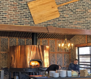 MozzaPi’s bright brass pizza oven