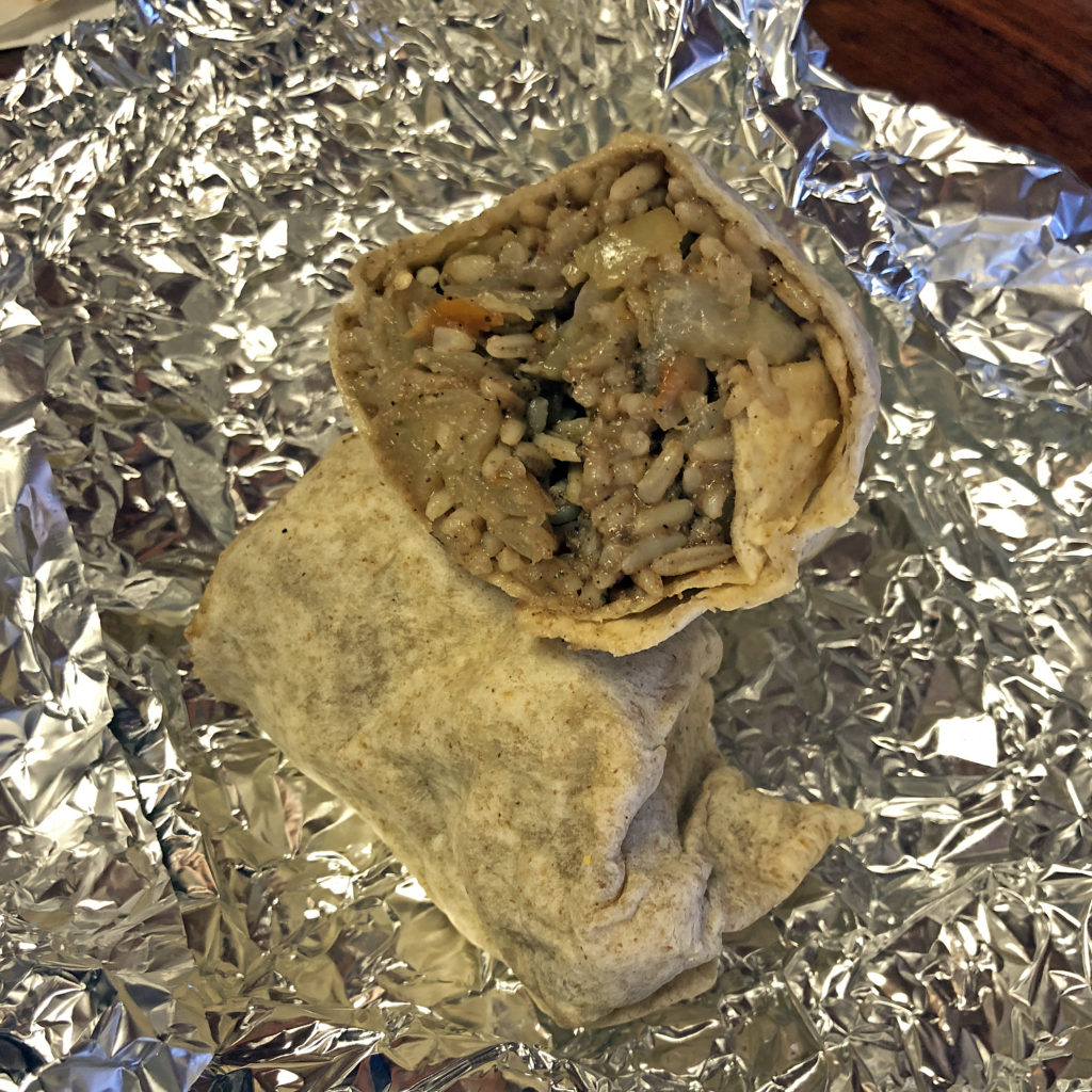Roof Top Grill’s Dread Loc wrap – we call it a Jamaican burrito – cut in half to display its interior.