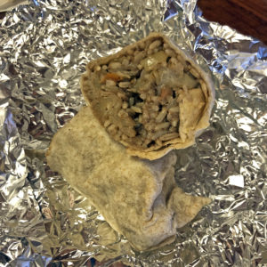 Roof Top Grill’s Dread Loc wrap – we call it a Jamaican burrito – cut in half to display its interior. 