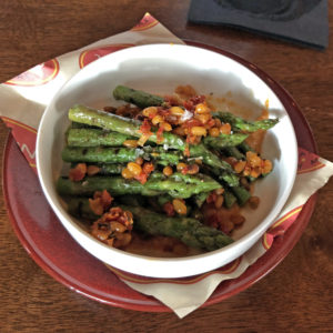 Grilled asparagus with piquant romesco sauce, a salad option at Artesano.