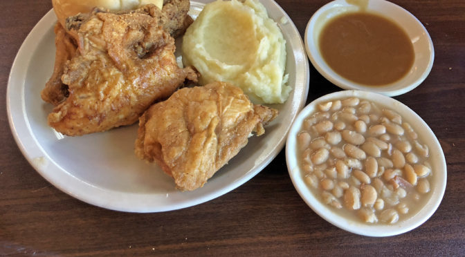 Cottage Inn’s iconic fried chicken, with mashed potatoes and gravy and a side of white beans.