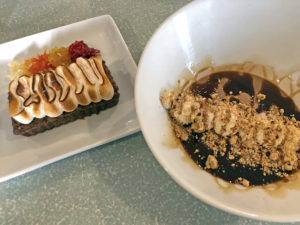 A pair of desserts at Kaelin’s: A bourbon-brown sugar tart and spiced chocolate panna cotta.