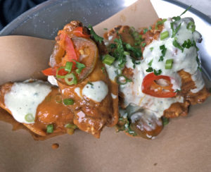 Crisp-fried chicken “wangs” in a savory michelada sauce at Pints & Union.