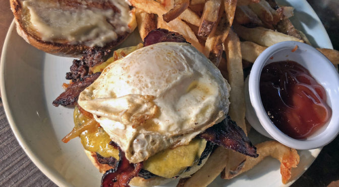 Not Just for Crazy People, the egg-topped breakfast burger at Le Moo.