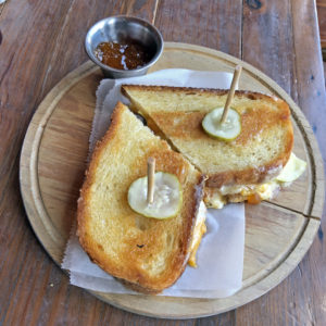 Three cheeses and dabs of apricot preserves and tart apples improve The Eagle’s grilled-cheese sandwich.