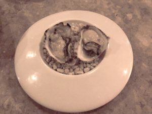 A pair of perfectly fresh West Coast oysters on the half shell looked gray in the dim light, but tasted great.