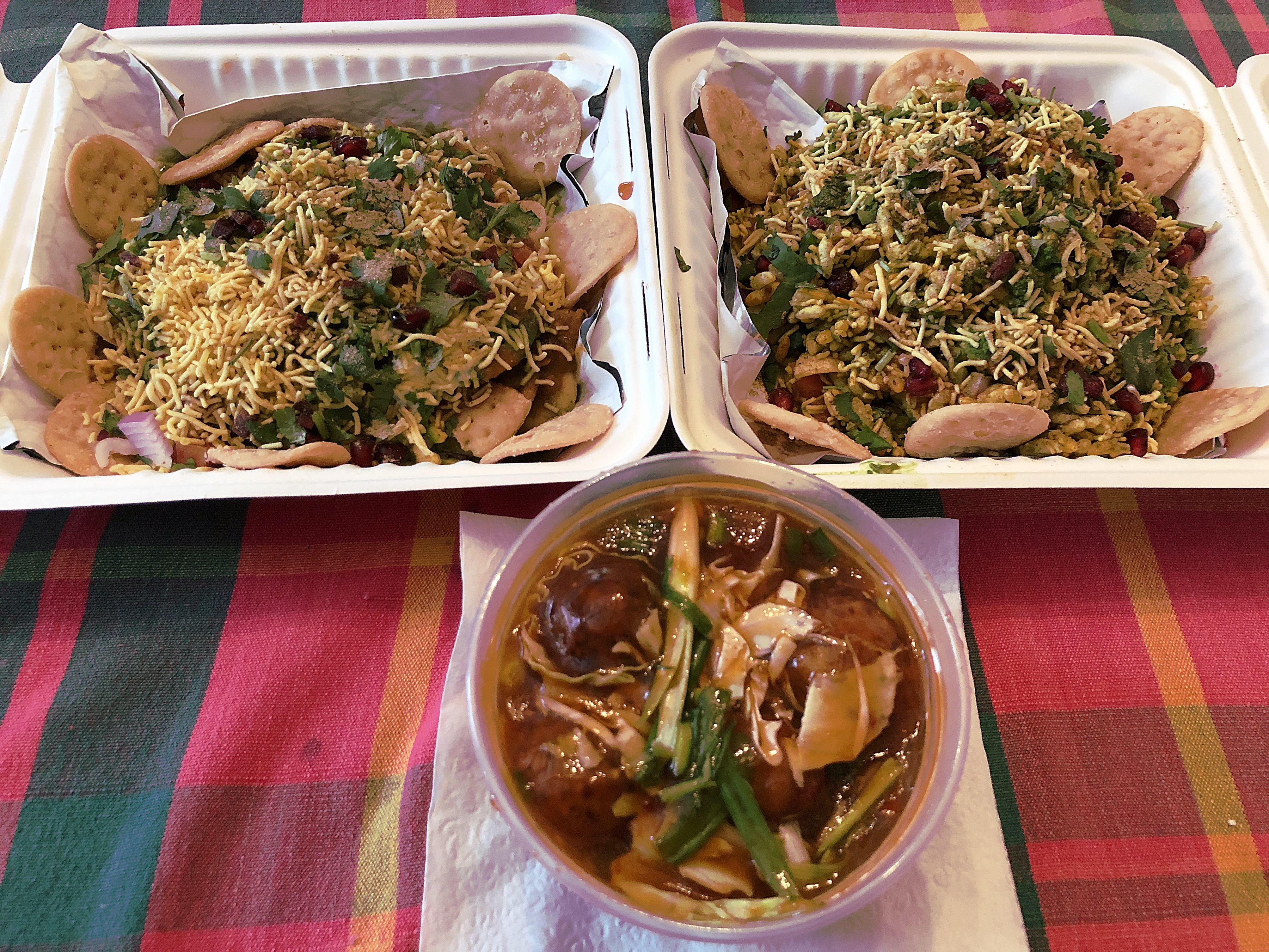 Three tempting takeouts from Shreeji Indian: On the top row, Papdi chaat and bhel puri; below, veggie Manchurian, Chinese food made Indian-style.