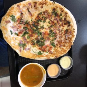 Shreeji Indian’s uttapam looks a bit like a pizza, but its flavors are all Indian. 