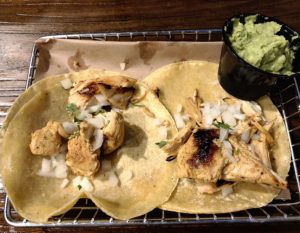 Sliced chicken adobo tacos at Down One Bourbon Bar.