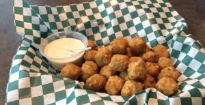 Gently seasoned and perfectly fried, Sal’s jalapeño cheese balls make a fine starter.
