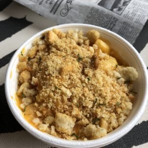 Stovetop-style macaroni and cheese at Hooked on Frankfort swims in creamy yellow cheese under a crunchy crumb topping.