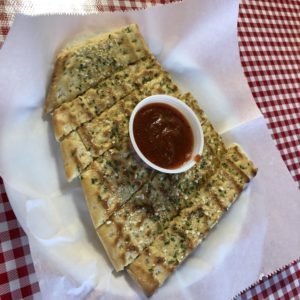 Milantoni’s complimentary garlic bread and sweet marinara makes a good start while you study the menu.