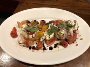 The heirloom tomato and burrata salad at Steak & Bourbon.