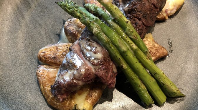 The 502 Bar & Bistro’s bistro steak, a medium-rare steak served with fingerling potatoes, asparagus, and brown butter beurre blanc.