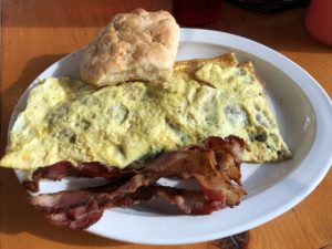 A veggie omelet with bacon and a biscuit at Burger Girl.