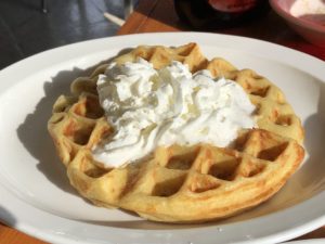 Burger Girl’s Belgian waffle comes with a dollop of whipped cream.