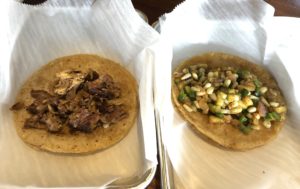 Two naked tacos – carnitas at left and veggie calabaza? – ready for a visit to La Catrina’s fixings bar. 