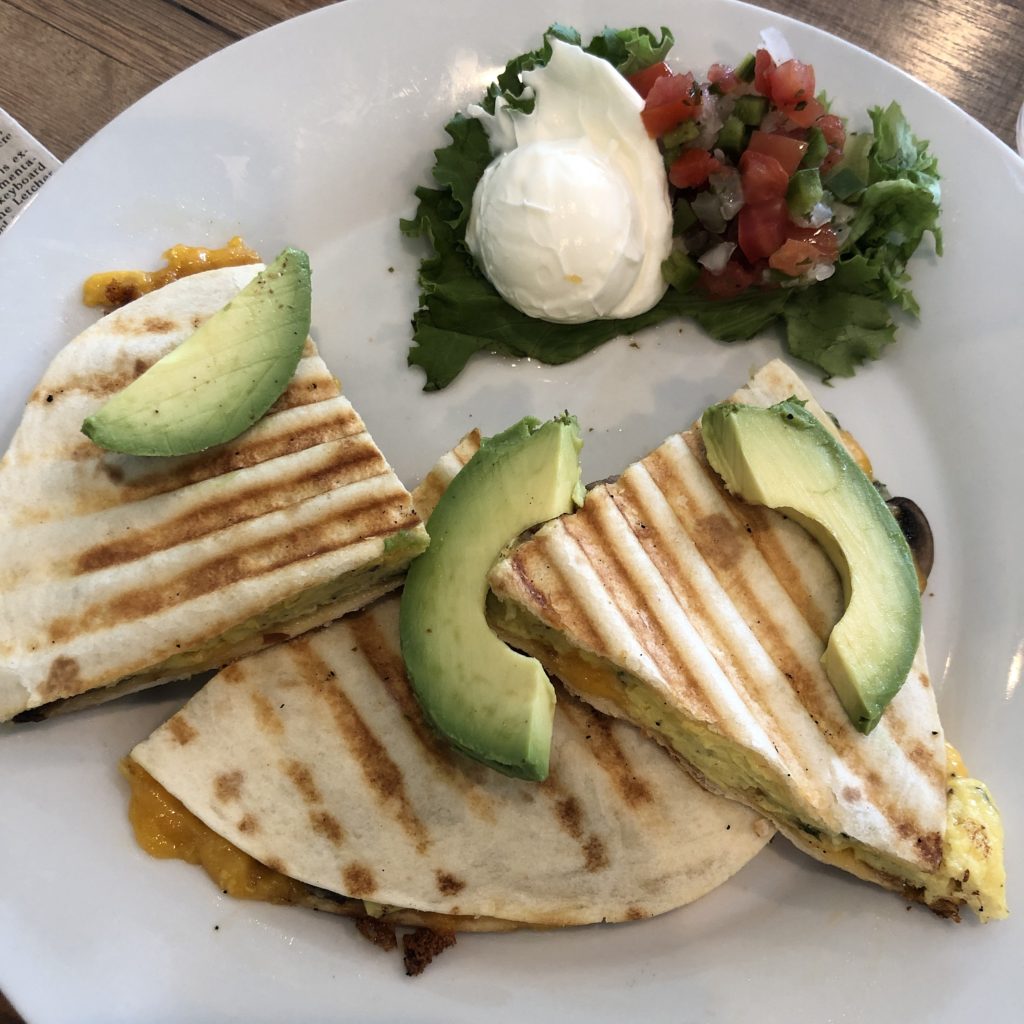 Avocado wedges top a build-your-own quesadilla at Gracious Plenty.