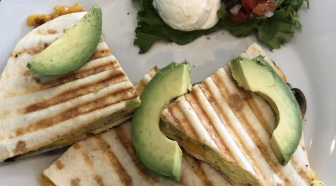 Avocado wedges top a build-your-own quesadilla at Gracious Plenty.