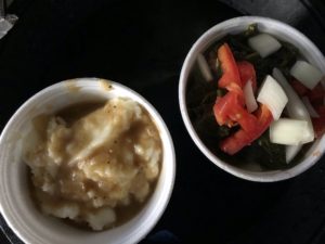 You can’t go wrong with Shirley Mae’s sides, like these mashed potatoes and gravy and fresh turnip greens.