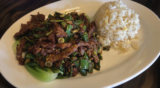 The cumin beef at Jasmine is dry-fried, crisp, fiery and deeply flavored.