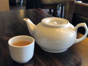 Jasmine’s hot tea is jasmine, of course, strong, floral-scented green tea.