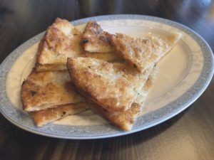 Onion cake makes a crunchy, appetizing onion-flavored starter at Jasmine.