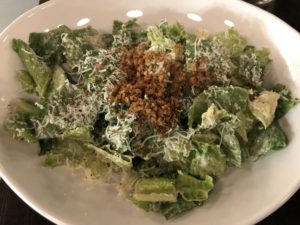 SOU’s caesar salad is topped with crunchy anchovy-scented crushed croutons.
