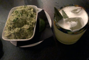 A bowl of chunky, well-made guacamole at Noche, with an intriguing sage-scented alebrije tequila cocktail. 